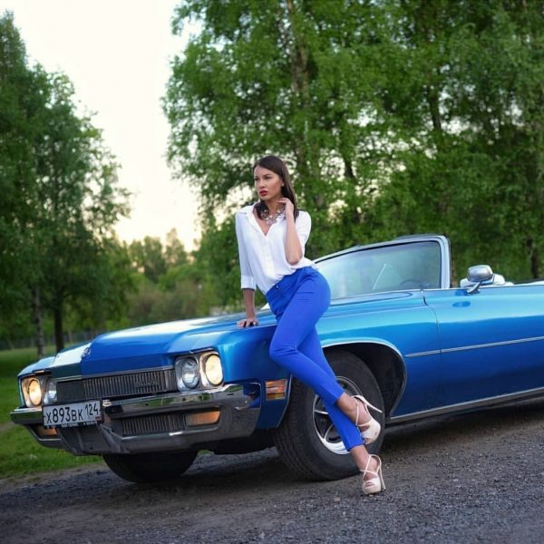 Women Hanging Around Buicks